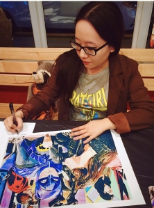 Signing my Batman and Catwoman print
